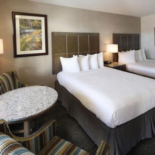 Best Western Plus Hilltop Inn | Redding, California | Two queen beds with white sheets and seating area