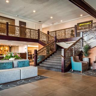 Best Western Plus Hilltop Inn | Redding, California | Brown stairs in entranceway to hotel